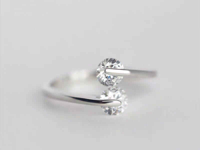 Sterling silver ring with suspended CZ diamonds